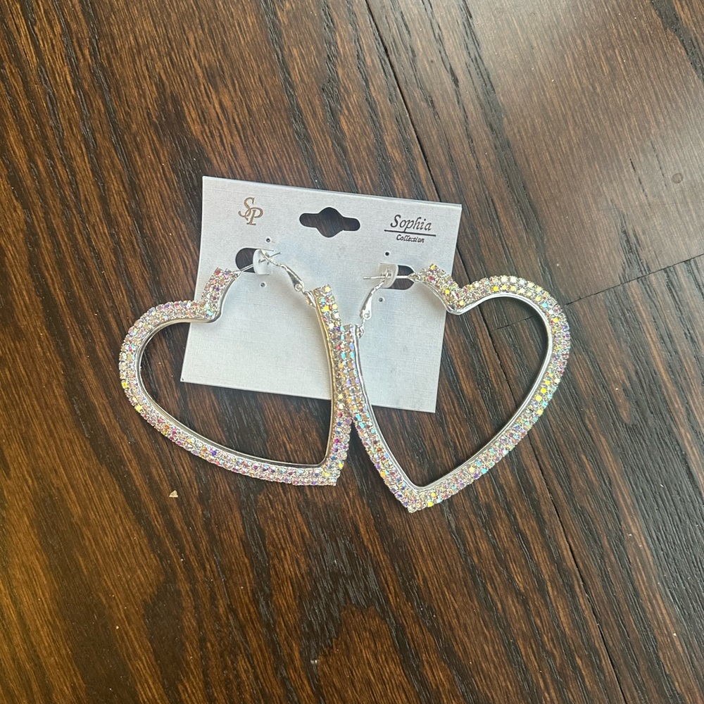 Sophia Collection large heart-shaped hoop earrings with iridescent rhinestones.